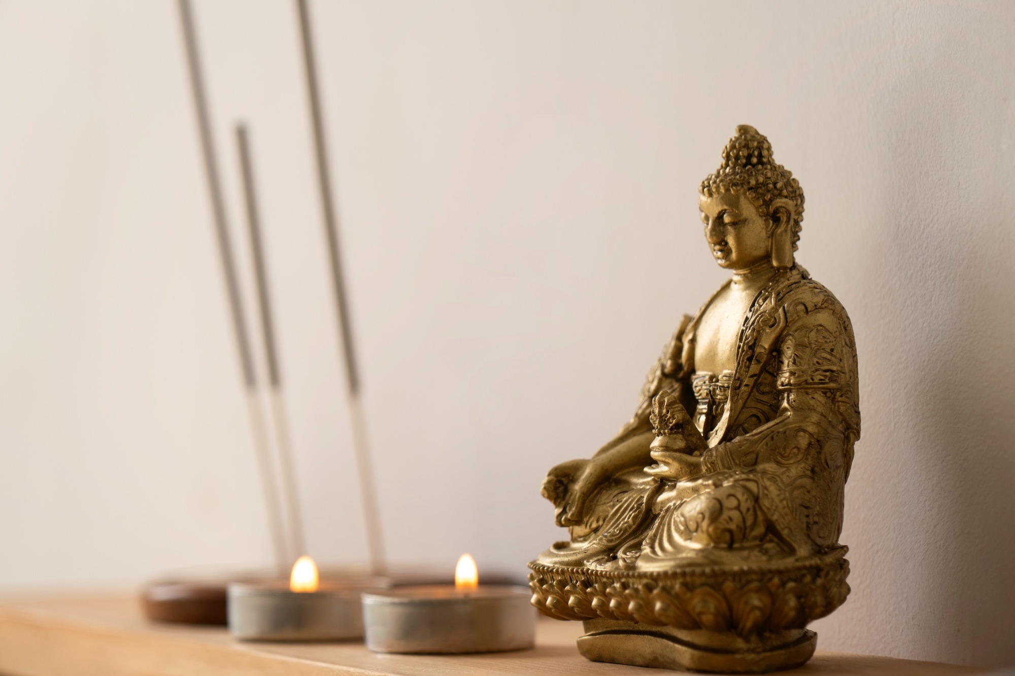 An 8-inch half gold-plated Tara statue placed on a bedroom altar